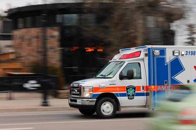 Ambulance rushing down street